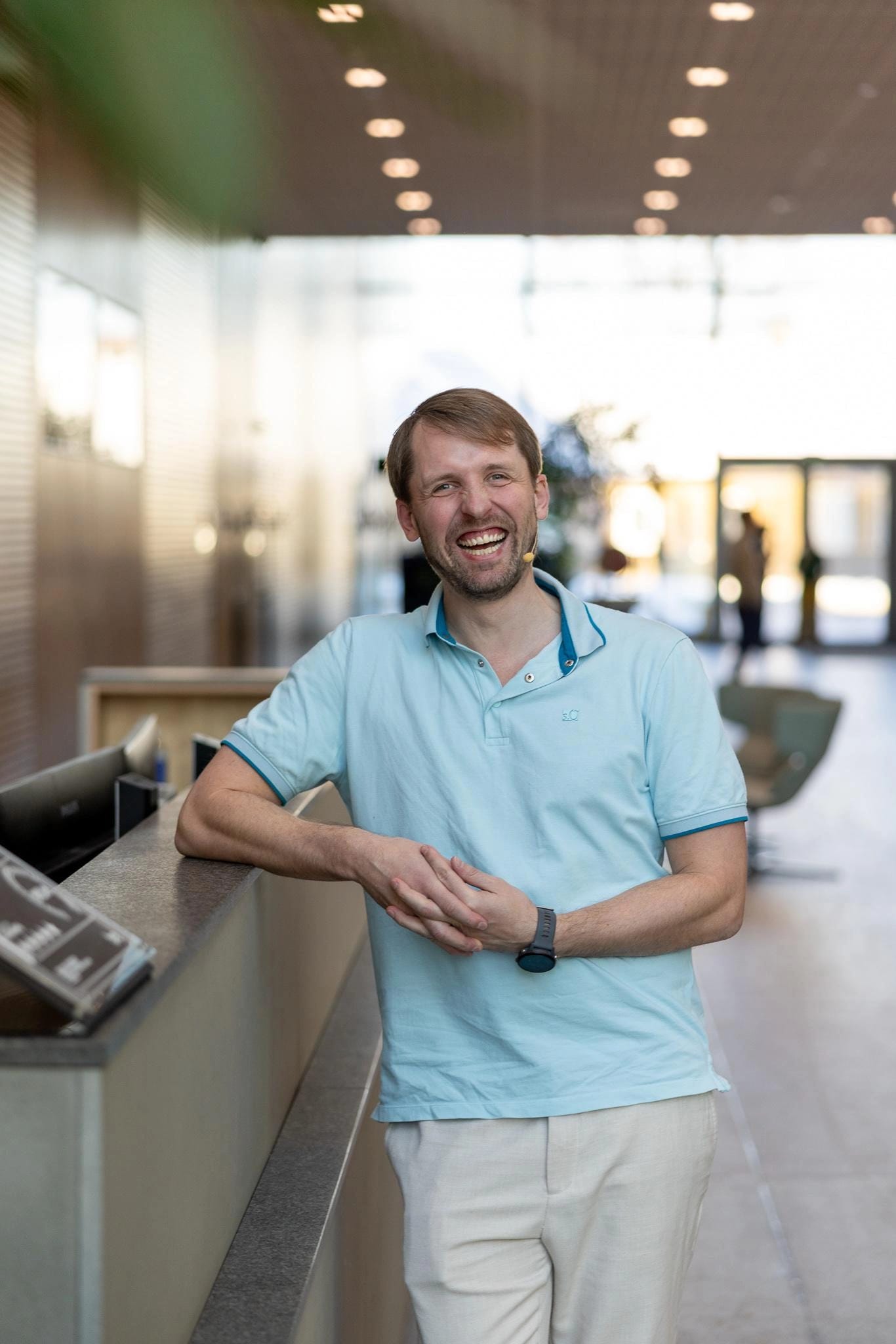 Rytis Luko smiling in a light-filled room